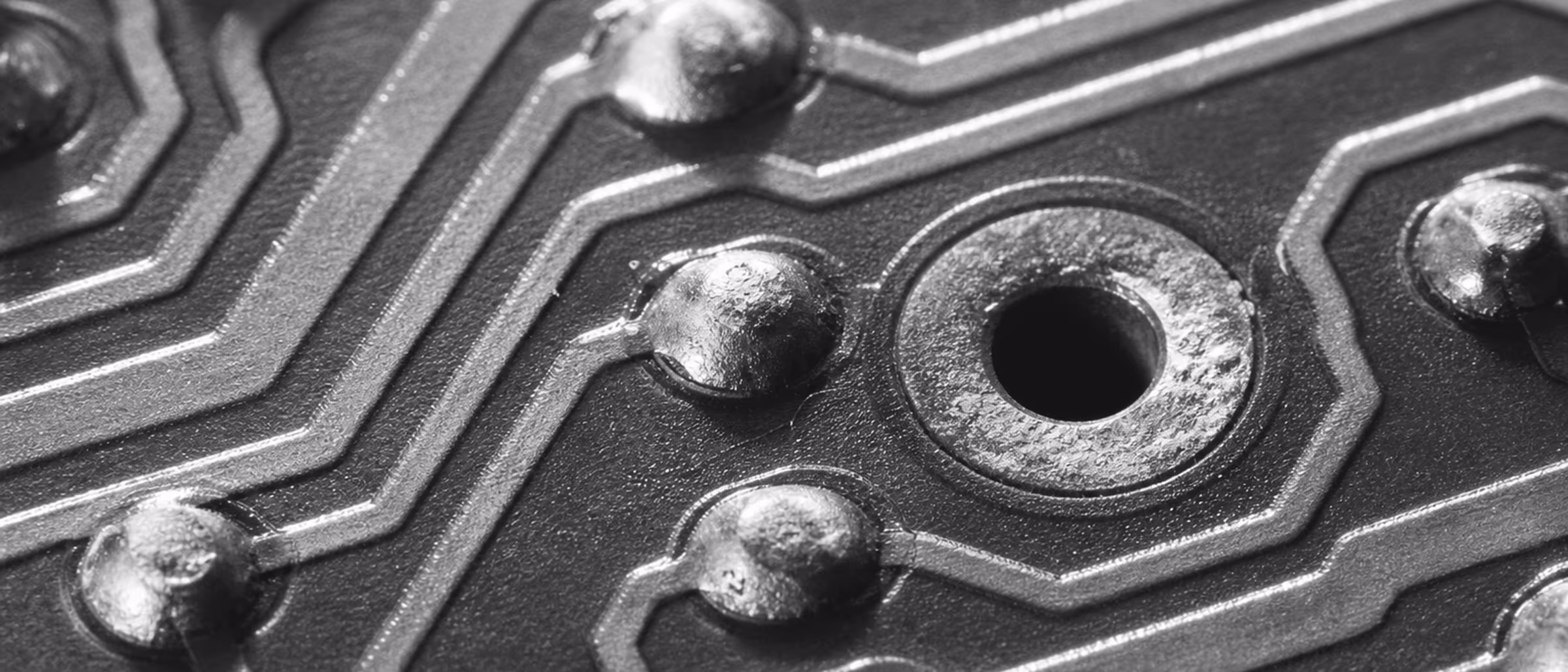 Black-and-white macro of printed circuit board traces